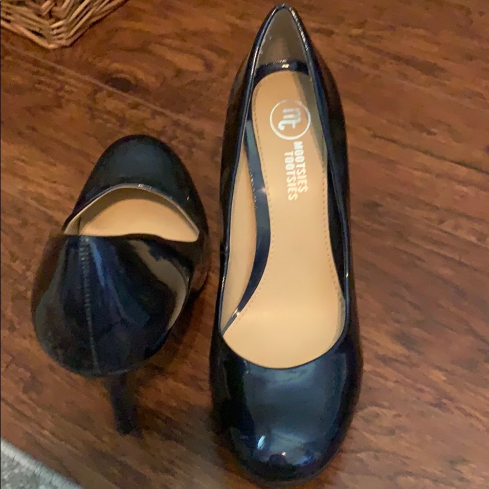 Navy patent heels